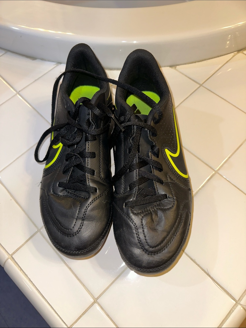 Nike Black youth Athletic cleat Shoes with Volt Swoosh